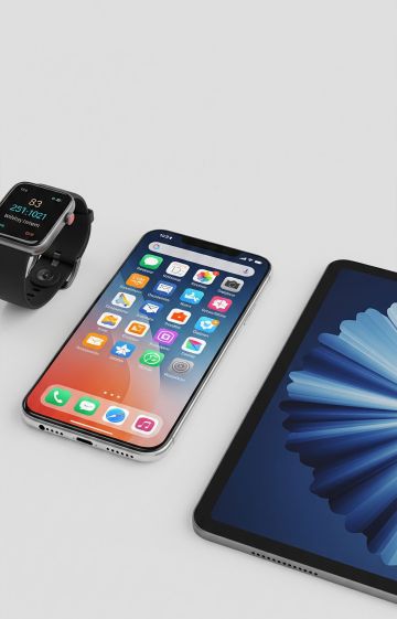 Smart devices laid out on a table, reviews of the latest electronics.