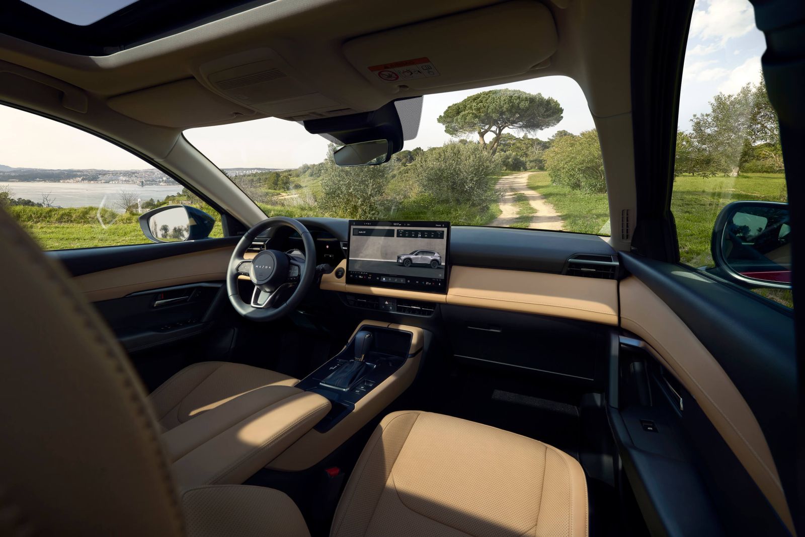 Interior view of the 2026 Mazda CX-5’s front cabin, photographed from the passenger side.