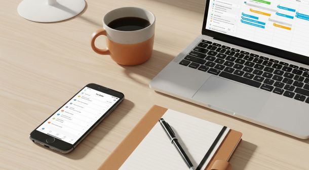Modern workspace with digital productivity apps on screen